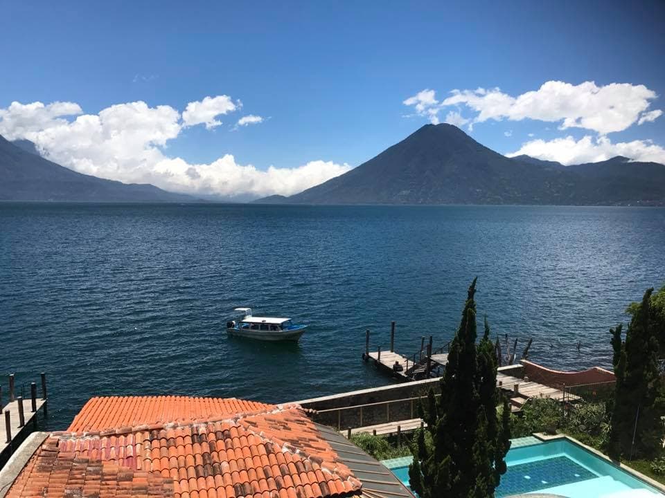 The property's tiled roofs, pool and private dock on the shore of Lake Atitlán